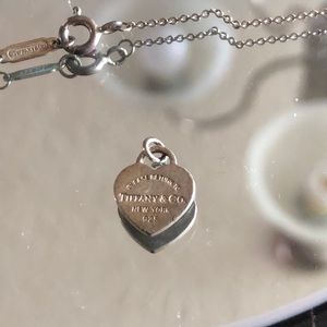 Tiffany and Co. necklace with charm.